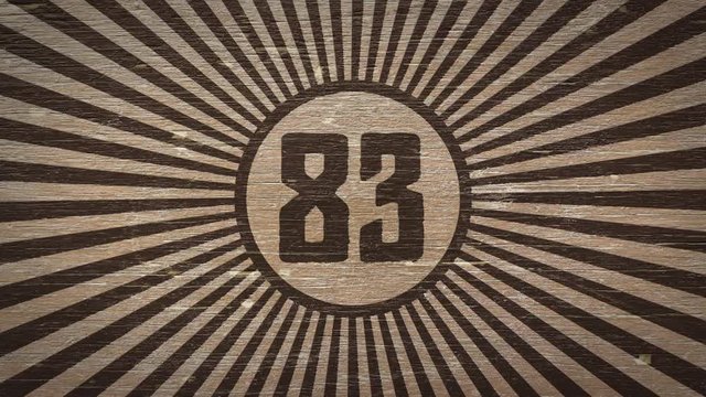 Number eighty-three On Wooden Texture. Ideal For Your Numbers / Countdown / Aniversary Projects. High Quality Seamless Animation. 4K, 60fps 