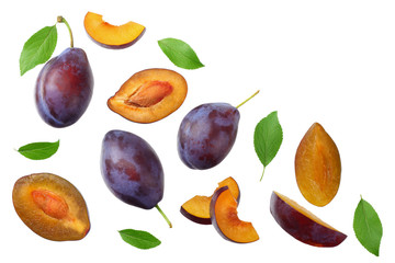 fresh plum fruit with green leaf and cut plum slices isolated on white background. top view