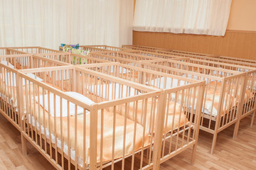 Fototapeta na wymiar Beds for kindergarten. Furniture for children preschoolers.