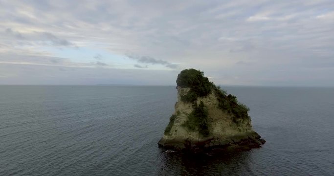 Panoramic View of the Beach and Stone Shaped Like a Piece of Cheese