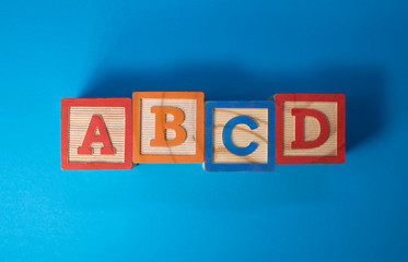 A, B, C and D wooden blocks