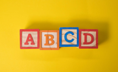 A, B, C and D wooden blocks