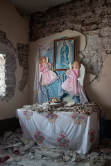 Houses and walls damaged by earthquake