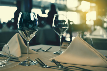 Served dinner table setting. Restaurant interior