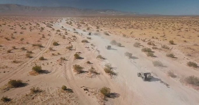 Military Trucks on Dirt Road
