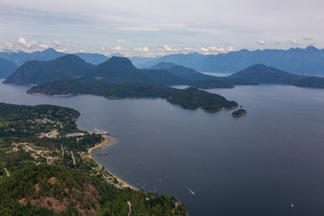 Fototapeta na wymiar Gibsons, Sunshine Coast, British Columbia, Canada. Aerial View of a small town in Howe Sound during a cloudy summer evening.