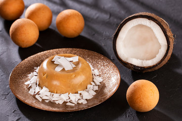Traditional Colombian bunuelos (Deep Fried Cheese Bread) and natilla - Text space