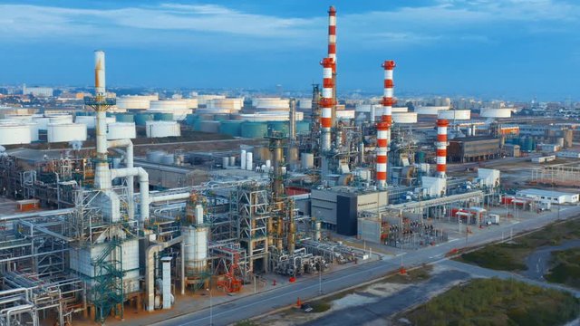 Aerial view of petrochemical oil refinery (refining complex). Oil and gas tanks with fuming pipes on the plant (factory)