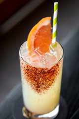 fresh grape and lime alcohol cocktail at a restaurant interior 