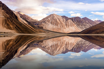 The reflection of mountain on the water. - obrazy, fototapety, plakaty