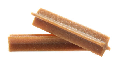 bones and colorful sticks for dog treat with vitamin and oral health on white background