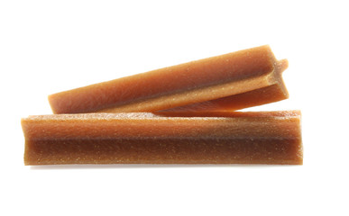 bones and colorful sticks for dog treat with vitamin and oral health on white background