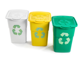 Containers for trash with recycling signs on white background