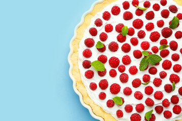 Tasty raspberry pie on color background
