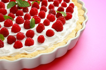 Tasty raspberry pie on color background, closeup