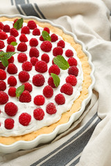Tasty raspberry pie on table