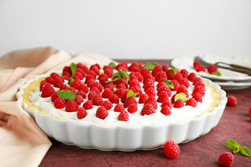 Tasty raspberry pie on table