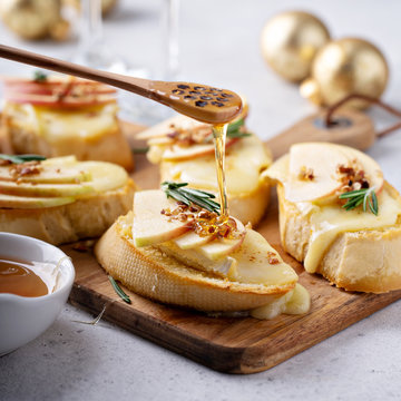 Pear and brie crostini with honey, pecan and rosemary, New Years Eve or Christmas party appetizer