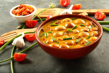 Mushroom curry served in ceramic bowl,