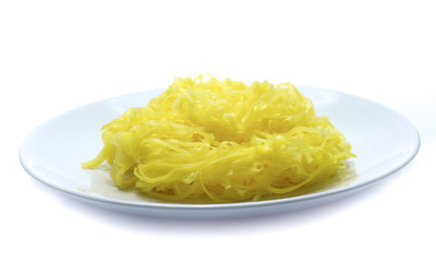 yellow noodles on dish isolated on white background