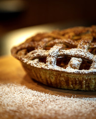 Fresh baked Apple pie on a dark wooden background
