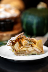Fresh baked Apple pie on a dark wooden background