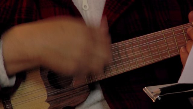  Man Playing the Charango, a Traditional Andean String Instrument in Bolivia, South America. Close-Up.