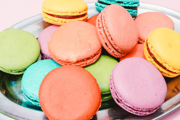 Fototapeta na wymiar colorful almond cookies on pink background
