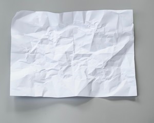 crumpled white paper on gray background blurred, can use text banners products or business cards your.