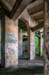 Graffiti covered old coal pier in Philadelphia, Pennsylvania called The Underground where young people go to play paintball.