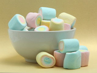 Fototapeta na wymiar colorful marshmallows candy on yellow background