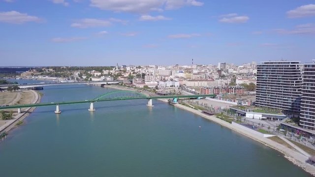 Incredible aerial slow panorama shot of Belgrade Waterfront on Sava river