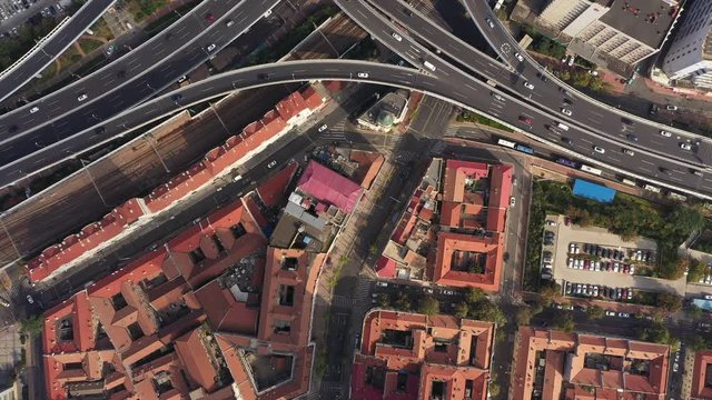 Contrast between historic colonial era architecture and modern highway intersection in Qingdao, aerial perspectives China
