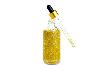 hands of a beautiful woman Dropping serum collagen moisturizer of face into clear yellow bottle soft light background. Protector skin Treatment facial essence oil, Vitamin C. Beauty and spa Con