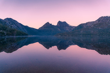 Picturesque nature background with Cradle Mountain and lake at sunrise