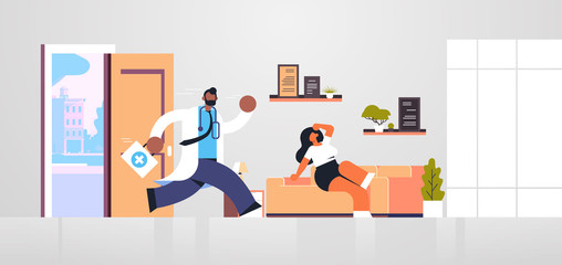 male doctor with first aid kit running to help woman patient medicine healthcare ambulance concept african american medical worker in white coat living room interior full length flat horizontal vector