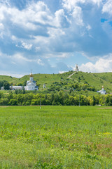 Monastery complex with white churches with golden cupola