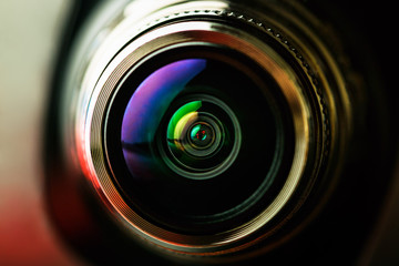 The camera lens with red and black backlight. Macro photography lenses. Horizontal photography