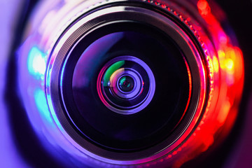 Camera lens with red and purple backlight. Macro photography lenses. Horizontal photography