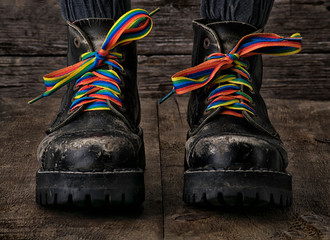 Brutal black boots with rainbow colored laces