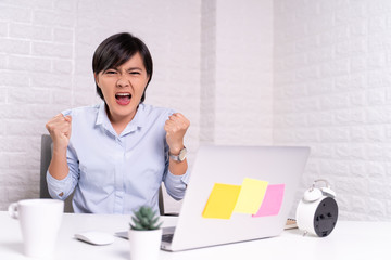 Angry woman working at office