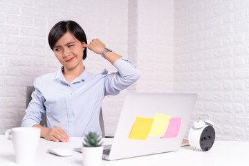 Woman putting a finger into her ear