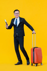 Asian business man with baggage ready to go for travel