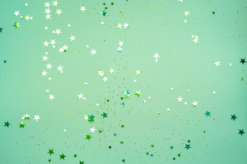 Scattered stars on a mint color background, Christmas, New year decorations