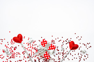 Two love magic wands and a gift. Valentine's Day concept. Copy space.