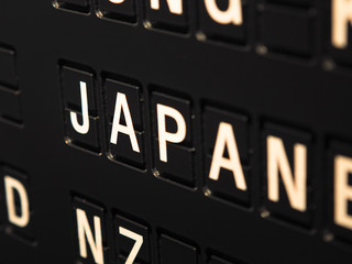 Obraz premium Signs name of Japan country on black directory board. Used for For currency exchange, airport, business, finance or travel concept, Signs and symbols.