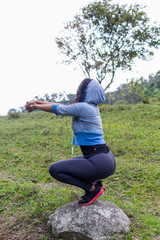 Woman exercising in the field