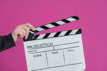 movie clapper on pink background