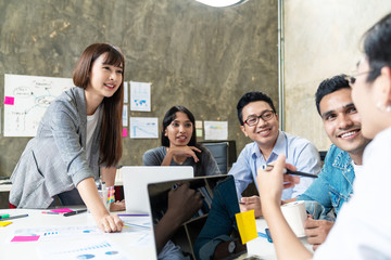 Candid of happy asian business people teamwork are brainstorming or discussion roadmap marketing. Leader woman is presentaion and planning  strategy for new business. Business brainstorm concept. © ChayTee