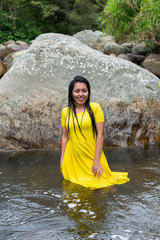 beautiful woman with yellow dress inside the water